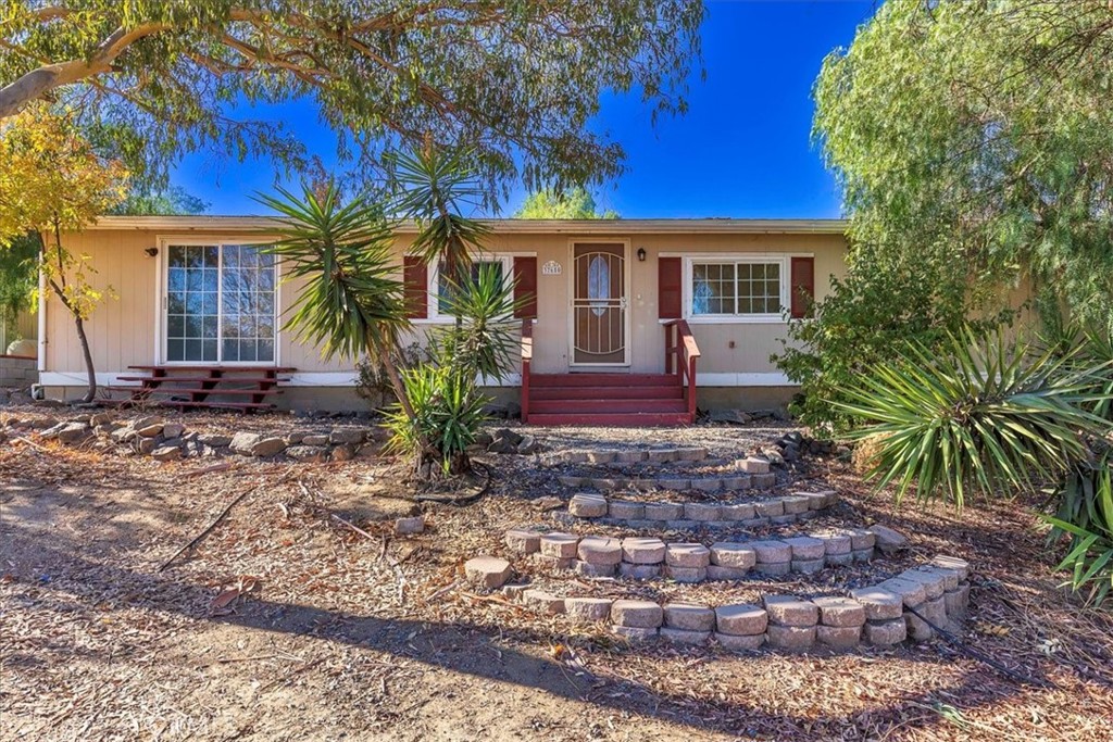 37650 Remuda Drive Temecula, CA 92592 - Photo 1 of 1 a front view of a house with garden