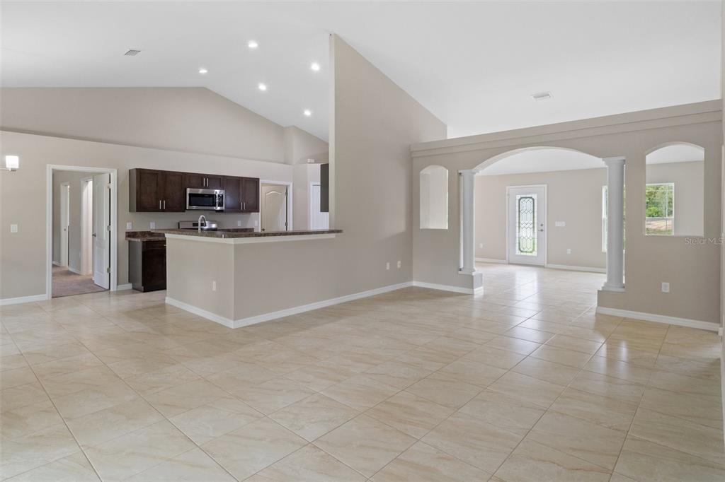 10342 Mirage Avenue Weeki Wachee, FL 34614 - Photo 11 of 45 a view of a kitchen with a sink and a stove top oven