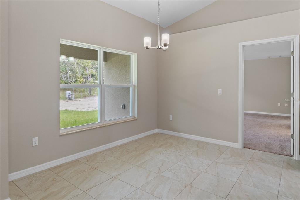 10342 Mirage Avenue Weeki Wachee, FL 34614 - Photo 13 of 45 an empty room with windows and closet