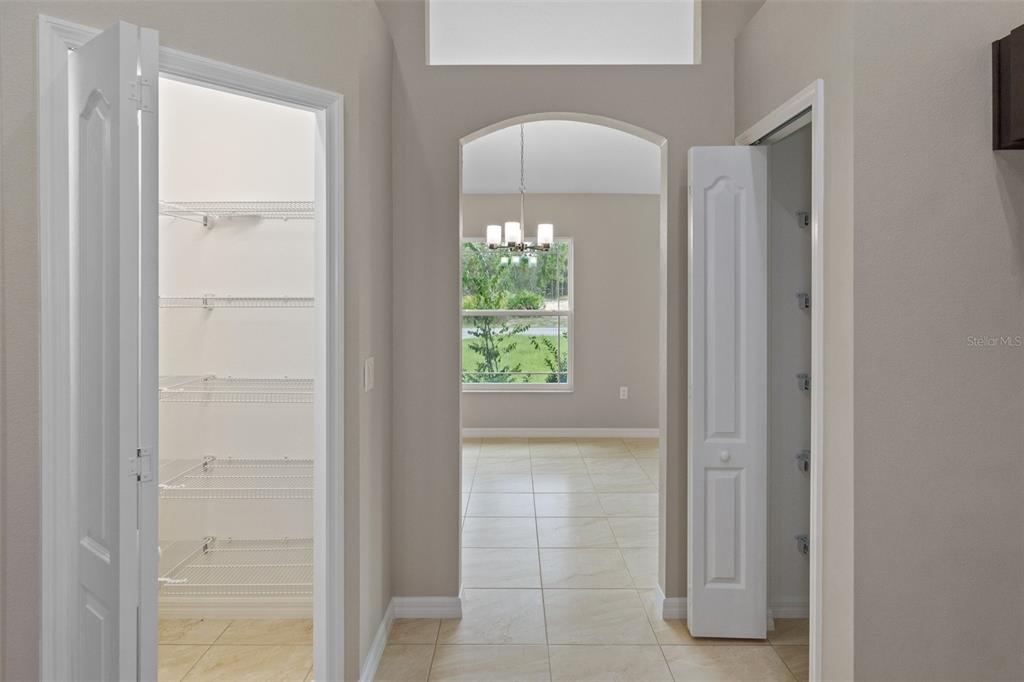 10342 Mirage Avenue Weeki Wachee, FL 34614 - Photo 21 of 45 a view of hallway with windows and chandelier