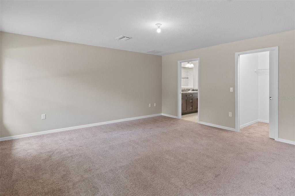 10342 Mirage Avenue Weeki Wachee, FL 34614 - Photo 26 of 45 a view of an empty room with closet and a window