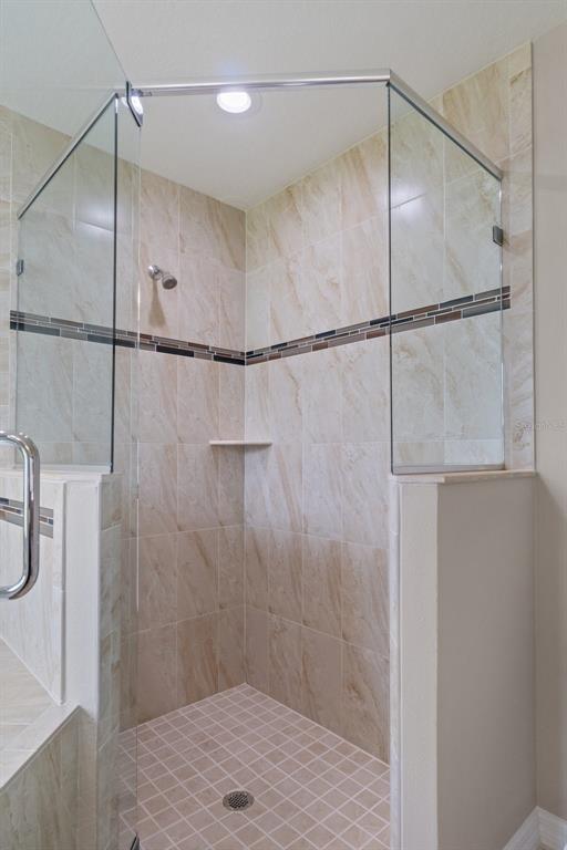 10342 Mirage Avenue Weeki Wachee, FL 34614 - Photo 31 of 45 a bathroom with a shower and a shower