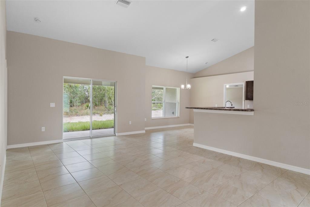 10342 Mirage Avenue Weeki Wachee, FL 34614 - Photo 8 of 45 a view of an empty room with a window