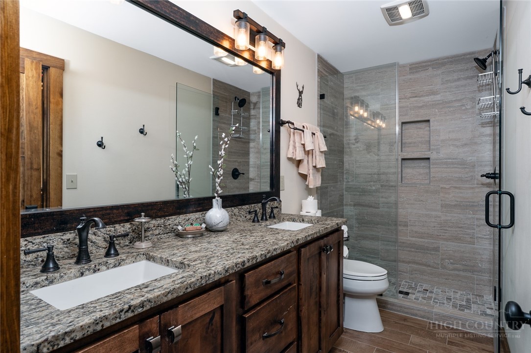 1161 Grandview Dr Extension Boone, NC 28607 - Photo 27 of 43 a bathroom with a granite countertop sink toilet and shower