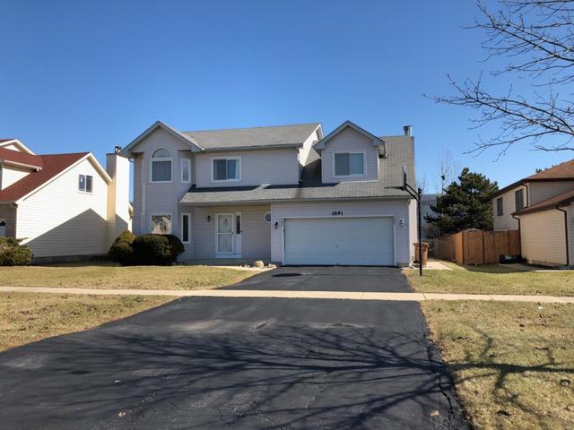 1891 President Street Glendale Heights, IL 60139 - Photo 1 of 23 a front view of a house with a yard
