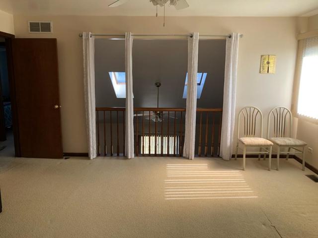 1891 President Street Glendale Heights, IL 60139 - Photo 11 of 23 a view of a livingroom with furniture and staircase