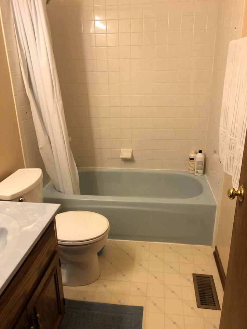 1891 President Street Glendale Heights, IL 60139 - Photo 19 of 23 a bathroom with a sink and a toilet