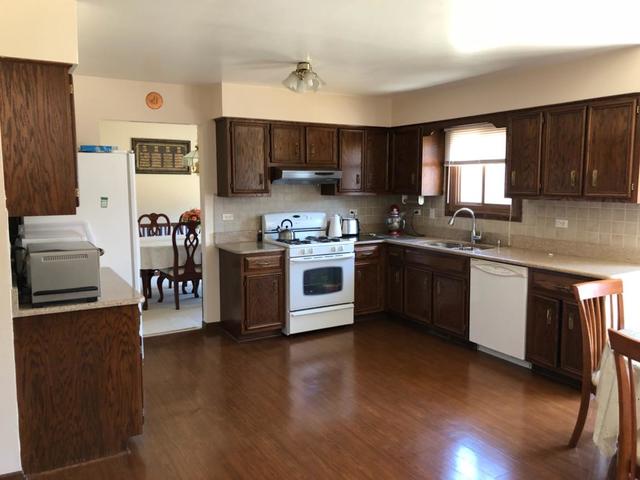 1891 President Street Glendale Heights, IL 60139 - Photo 4 of 23 a kitchen with stainless steel appliances granite countertop a stove top oven a sink dishwasher and a refrigerator