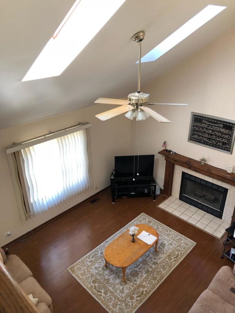 1891 President Street Glendale Heights, IL 60139 - Photo 7 of 23 a living room with furniture and a fireplace