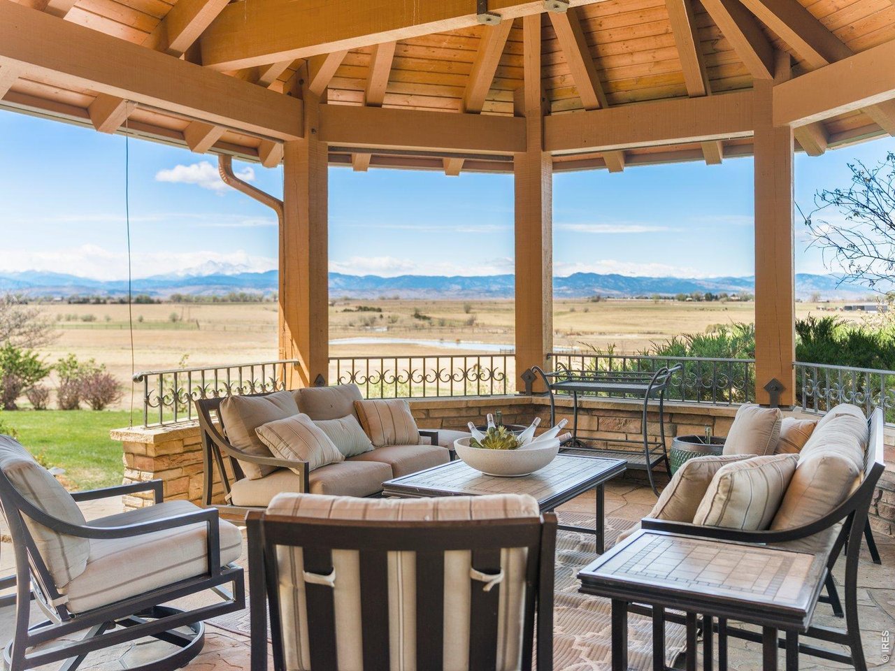 15383 East County Line Road Berthoud, CO 80513 - Photo 25 of 47 a balcony with furniture and city view
