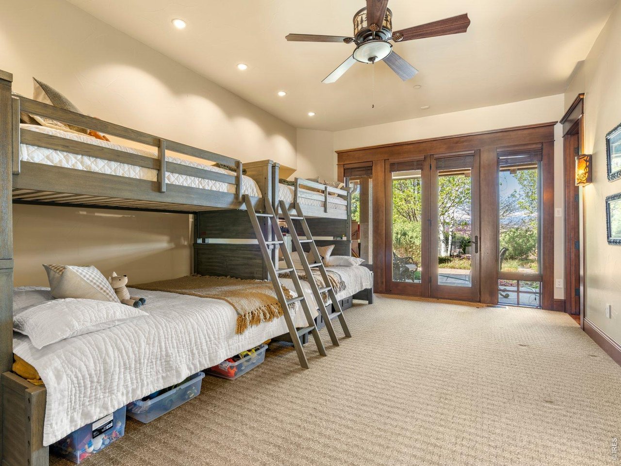 15383 East County Line Road Berthoud, CO 80513 - Photo 33 of 47 a bedroom with a bed and large glass windows