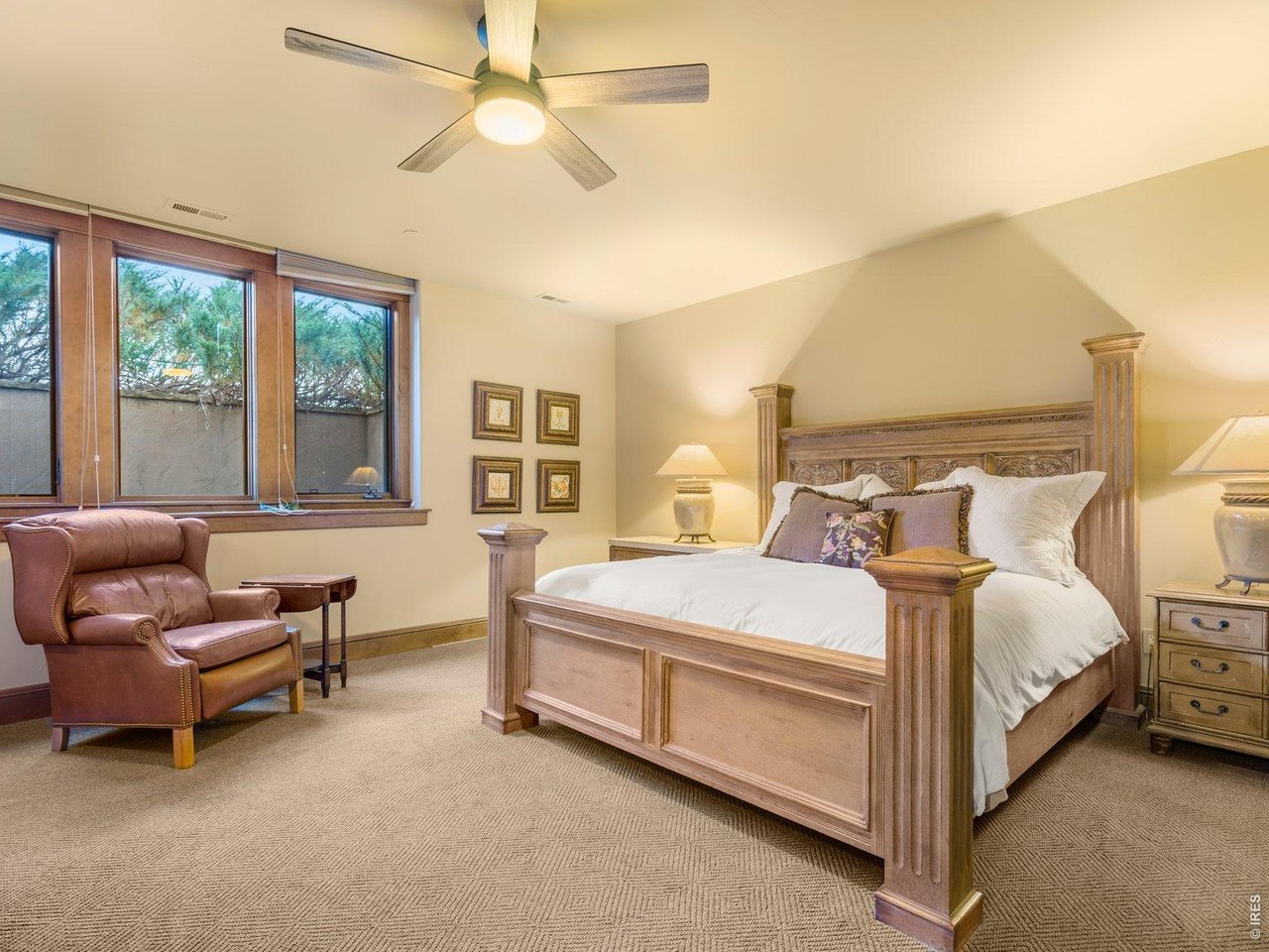 15383 East County Line Road Berthoud, CO 80513 - Photo 34 of 47 a bed room with a bed and a chair