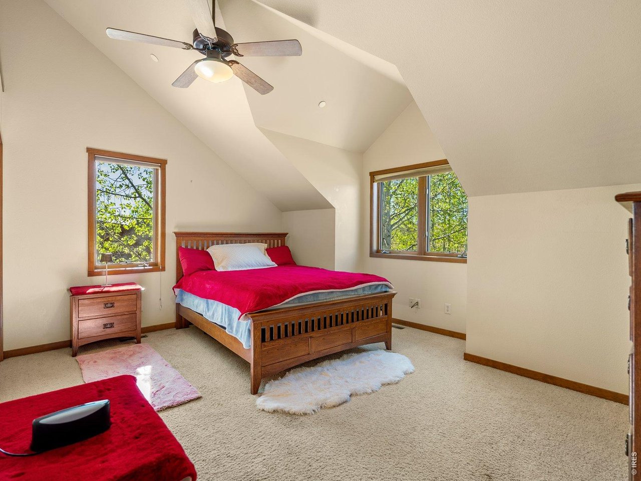 15383 East County Line Road Berthoud, CO 80513 - Photo 42 of 47 a bedroom with a bed and a window