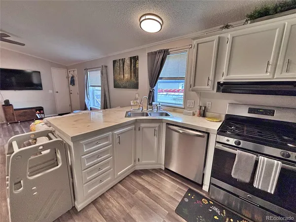 a kitchen with appliances and cabinets