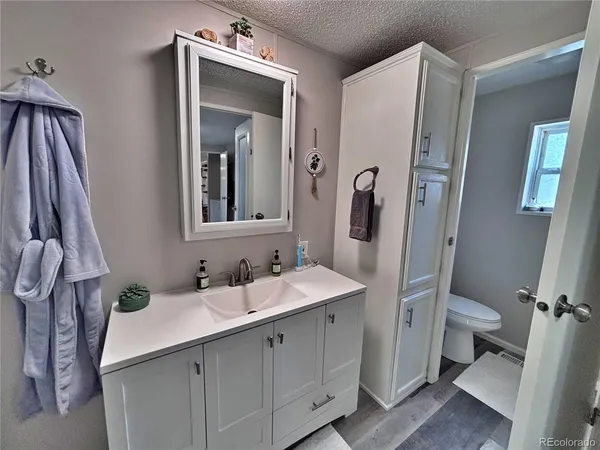a bathroom with a double vanity sink mirror double and shower