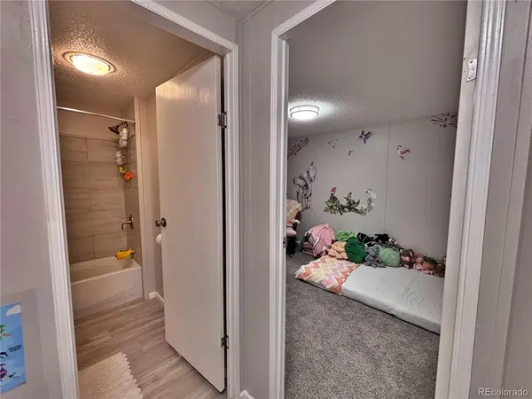 a bedroom with furniture and a chandelier