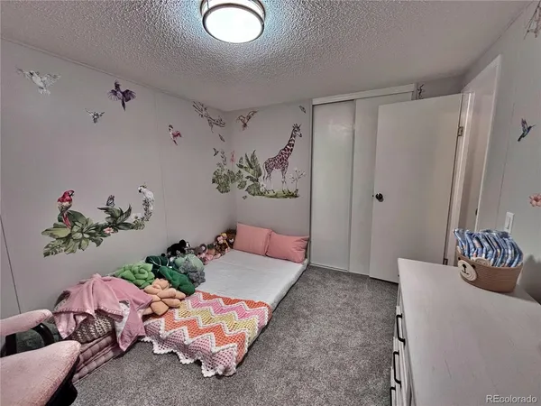 a view of a backyard with sitting area