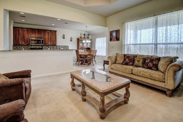 a spacious bedroom with a bed and a window