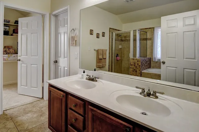 a bathroom with a shower and a bathtub