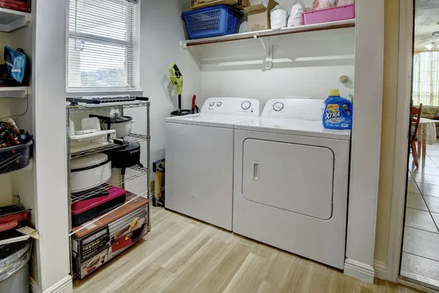 a view of a livingroom with furniture and a flat screen tv