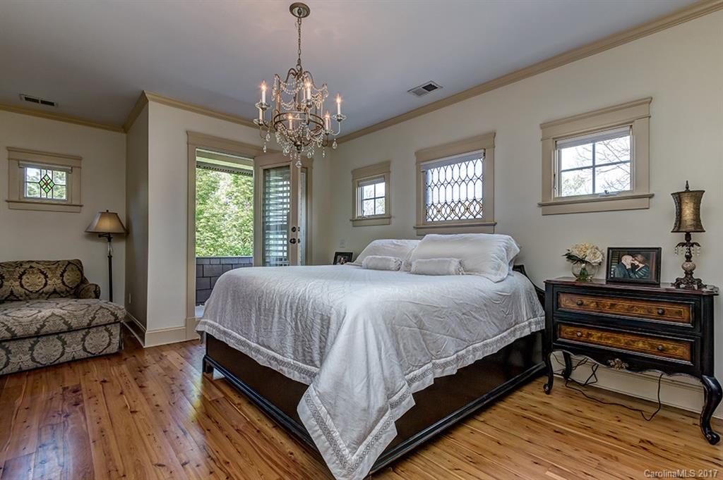 378 Elis Way Fort Mill, SC 29708 - Photo 14 of 23 a spacious bedroom with a bed and a chandelier