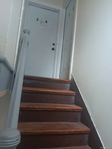 a view of room with wooden floor