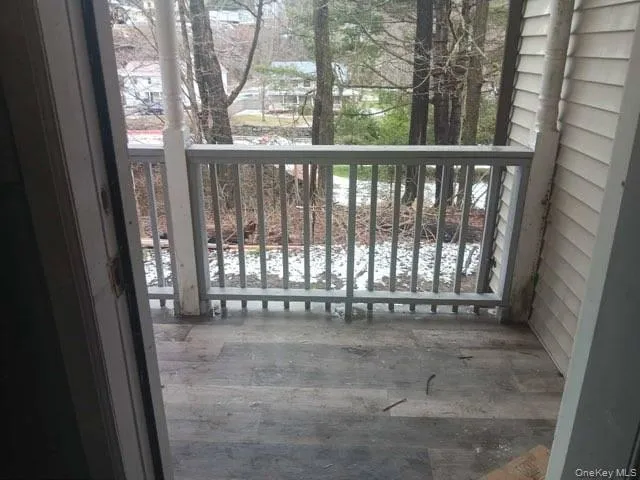 a view of an empty room with a balcony