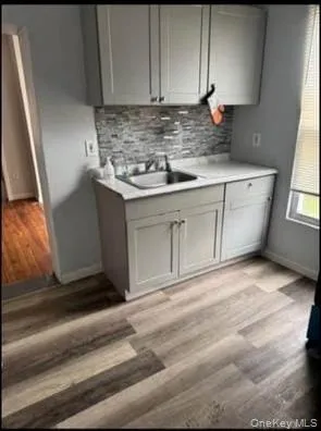 a kitchen with granite countertop cabinets stainless steel appliances and a sink