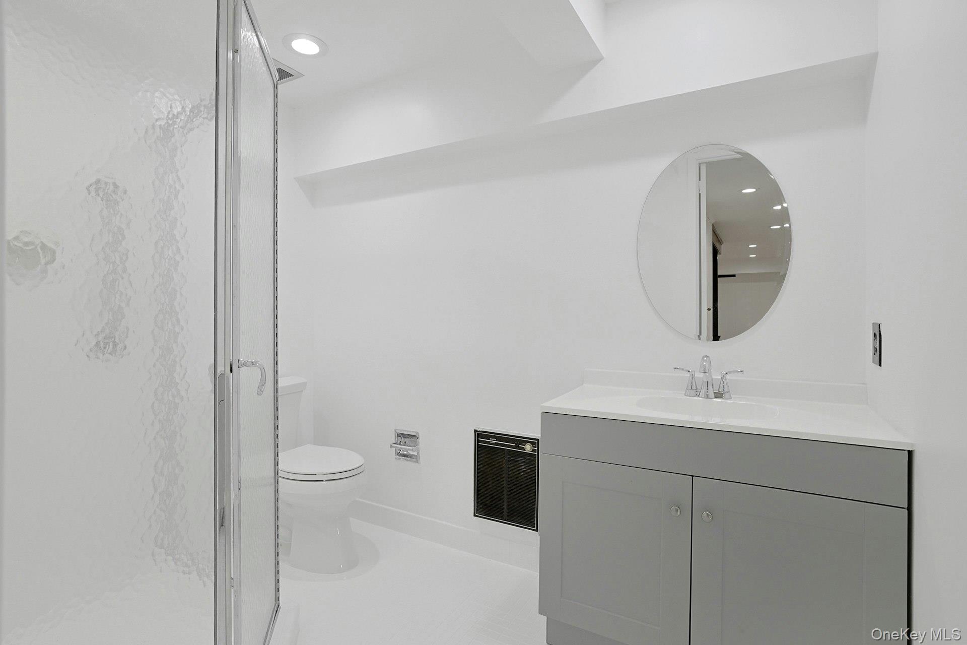 14 Withington Road Scarsdale, NY 10583 - Photo 34 of 41 a bathroom with a toilet sink and mirror