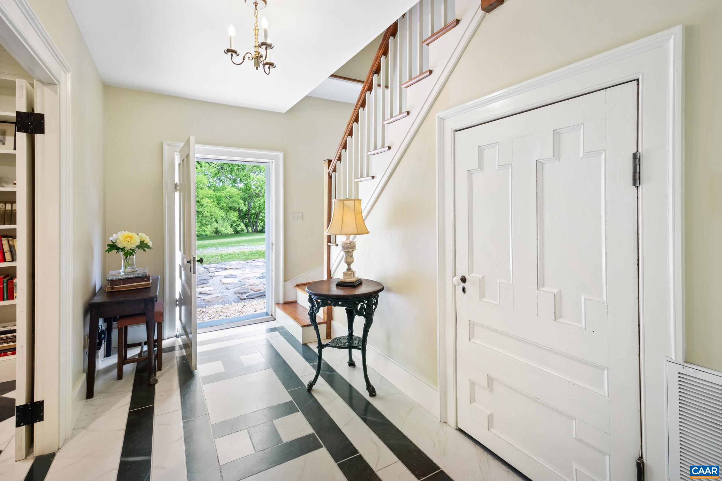 3276 Buckingham Springs Road Dillwyn, VA 23936 - Photo 18 of 47 a view of a hallway with wooden floor and furniture