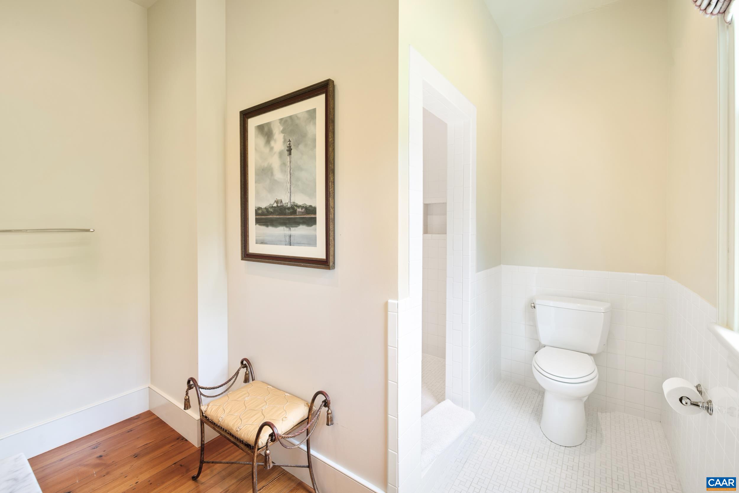 3276 Buckingham Springs Road Dillwyn, VA 23936 - Photo 29 of 47 a white toilet sitting next to a bathroom sink and vanity