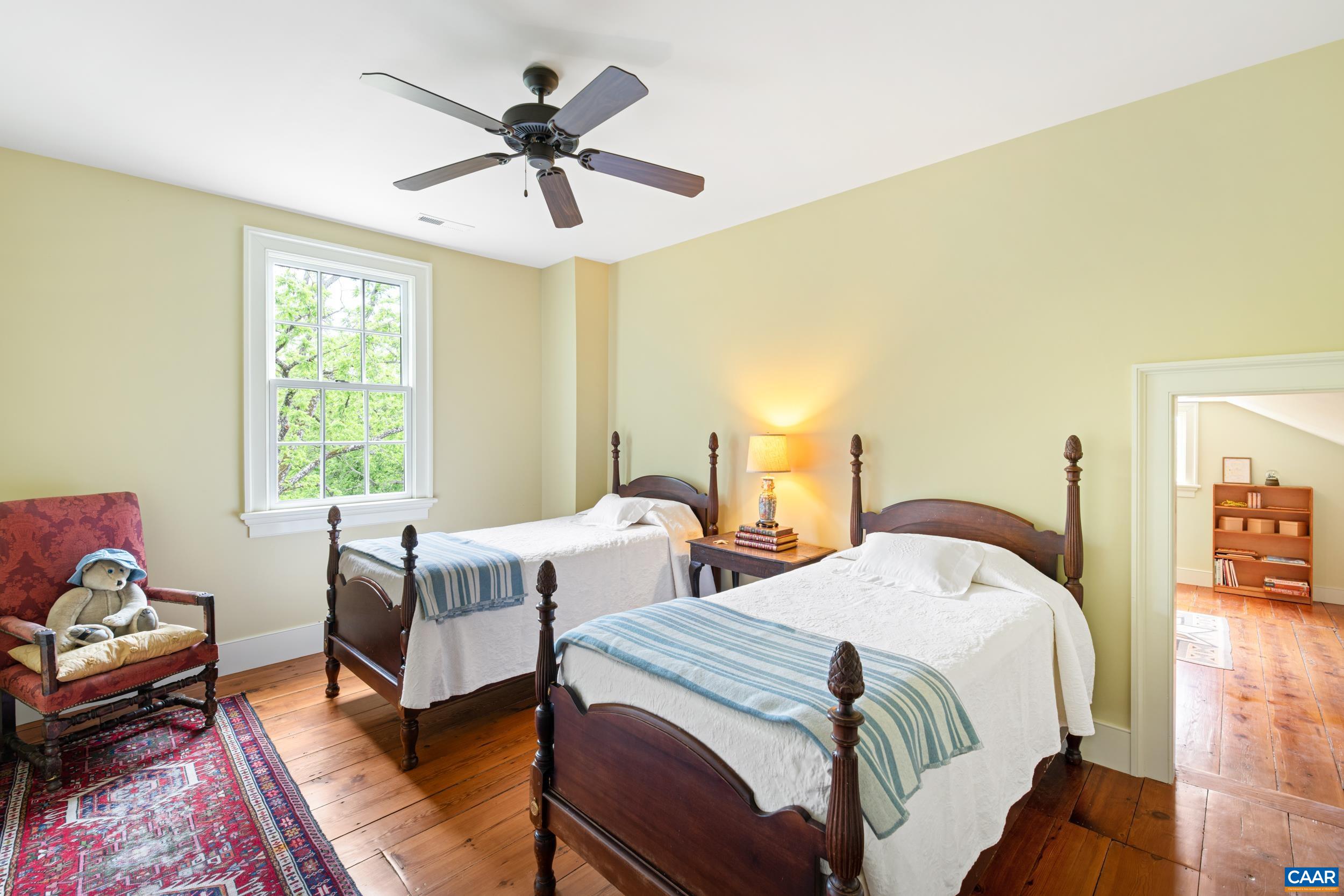 3276 Buckingham Springs Road Dillwyn, VA 23936 - Photo 32 of 47 a bedroom with two beds and a chandelier