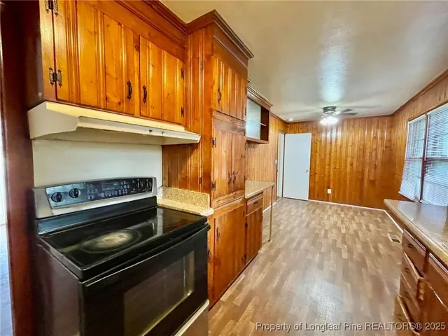 a kitchen with a stove and a microwave