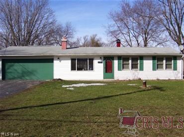3031 Denny Road Ravenna, OH 44266 - Photo 1 of 1 Front of house, 2.5 car extra deep garage. Has cold water with floor drain. Wash truck or car in the Winter!