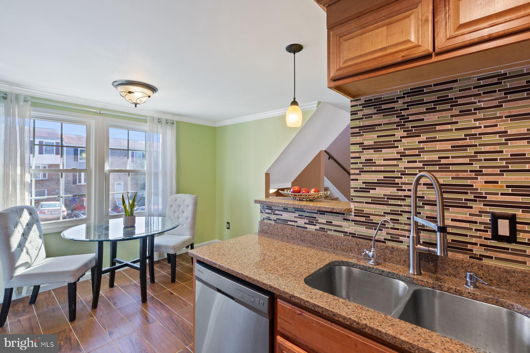 17660 Kohlhoss Road Poolesville, MD 20837 - Photo 5 of 22 a kitchen with a sink a counter space and a window