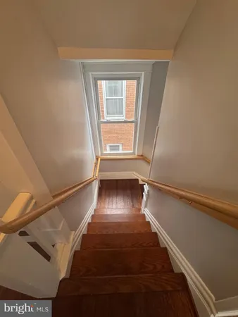 a view of entryway with wooden floor