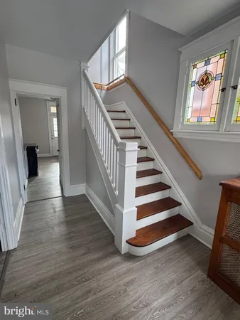 a view of an entryway with wooden floor