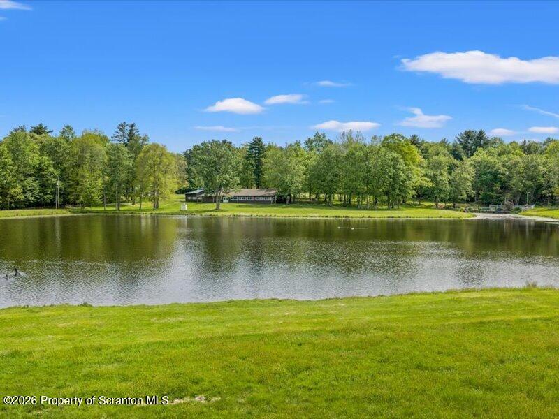9-17 Vago Road Tunkhannock, PA 18657 - Photo 34 of 57 a view of a lake with a house in the background
