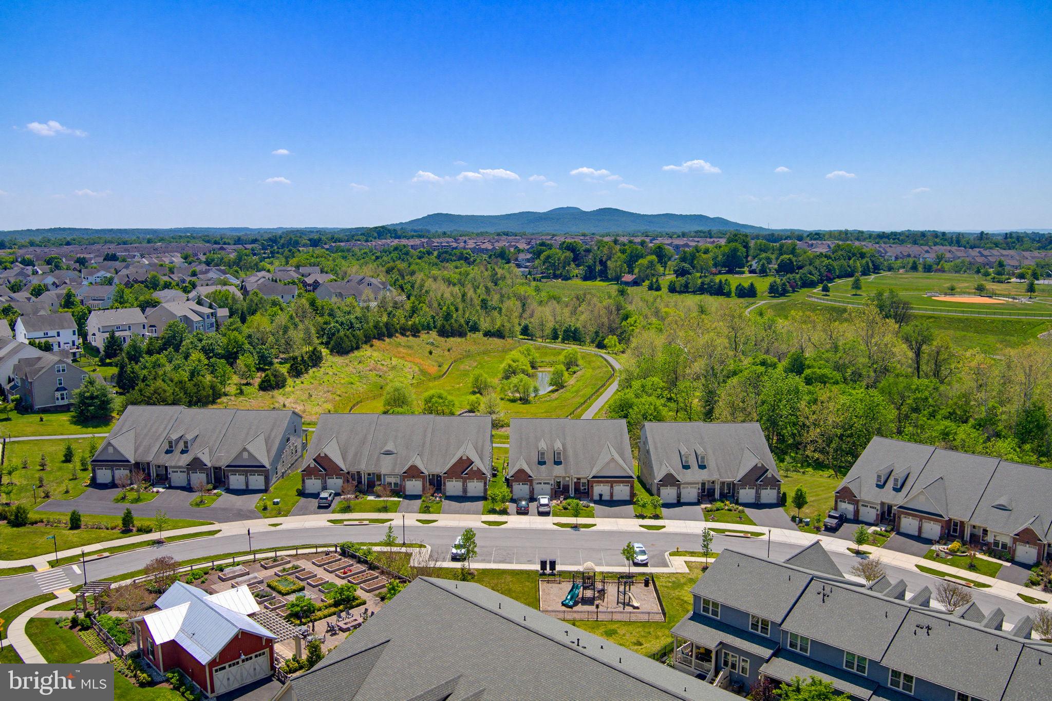 3816 Fulham Road Frederick, MD 21704 - Photo 6 of 77 an aerial view of a house with a swimming pool outdoor seating and yard