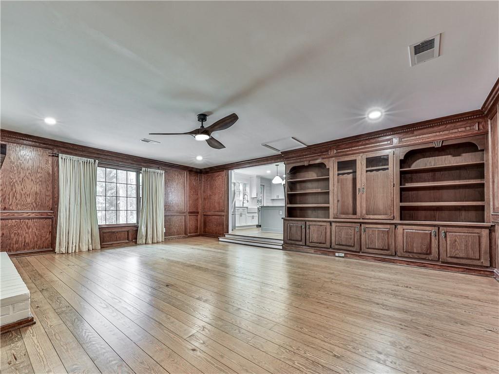 633 Butterworth Road Canton, GA 30114 - Photo 18 of 55 a view of an empty room with wooden floor and a ceiling fan