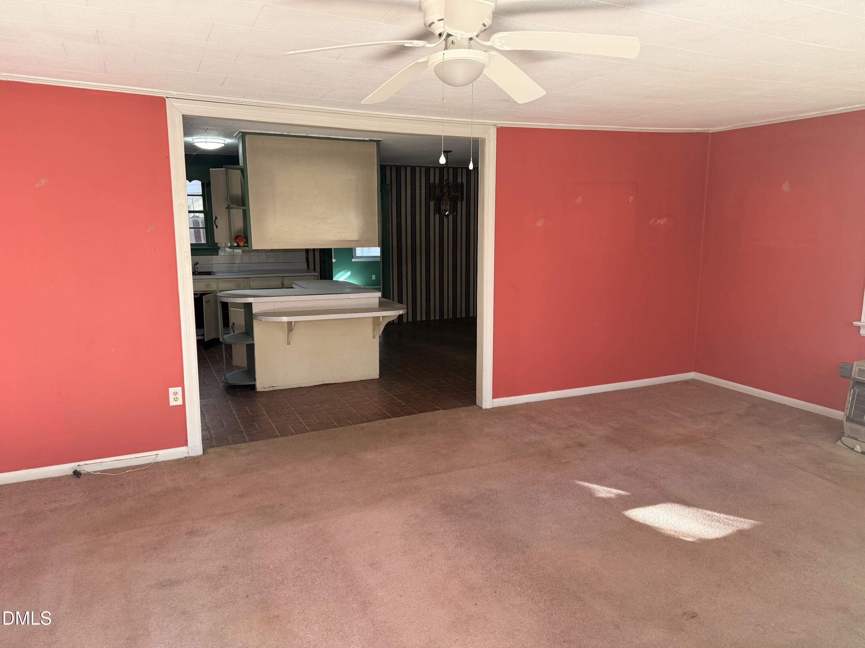 8066 Springfield School Road Kenly, NC 27542 - Photo 3 of 11 a kitchen with a refrigerator and a sink