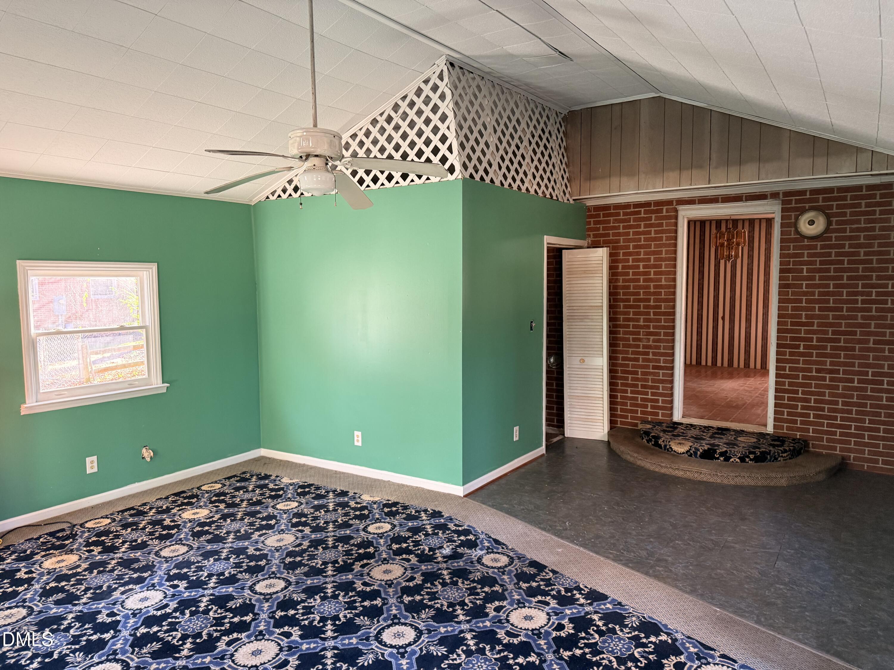 8066 Springfield School Road Kenly, NC 27542 - Photo 8 of 11 a view of a room with window chandelier fan and windows