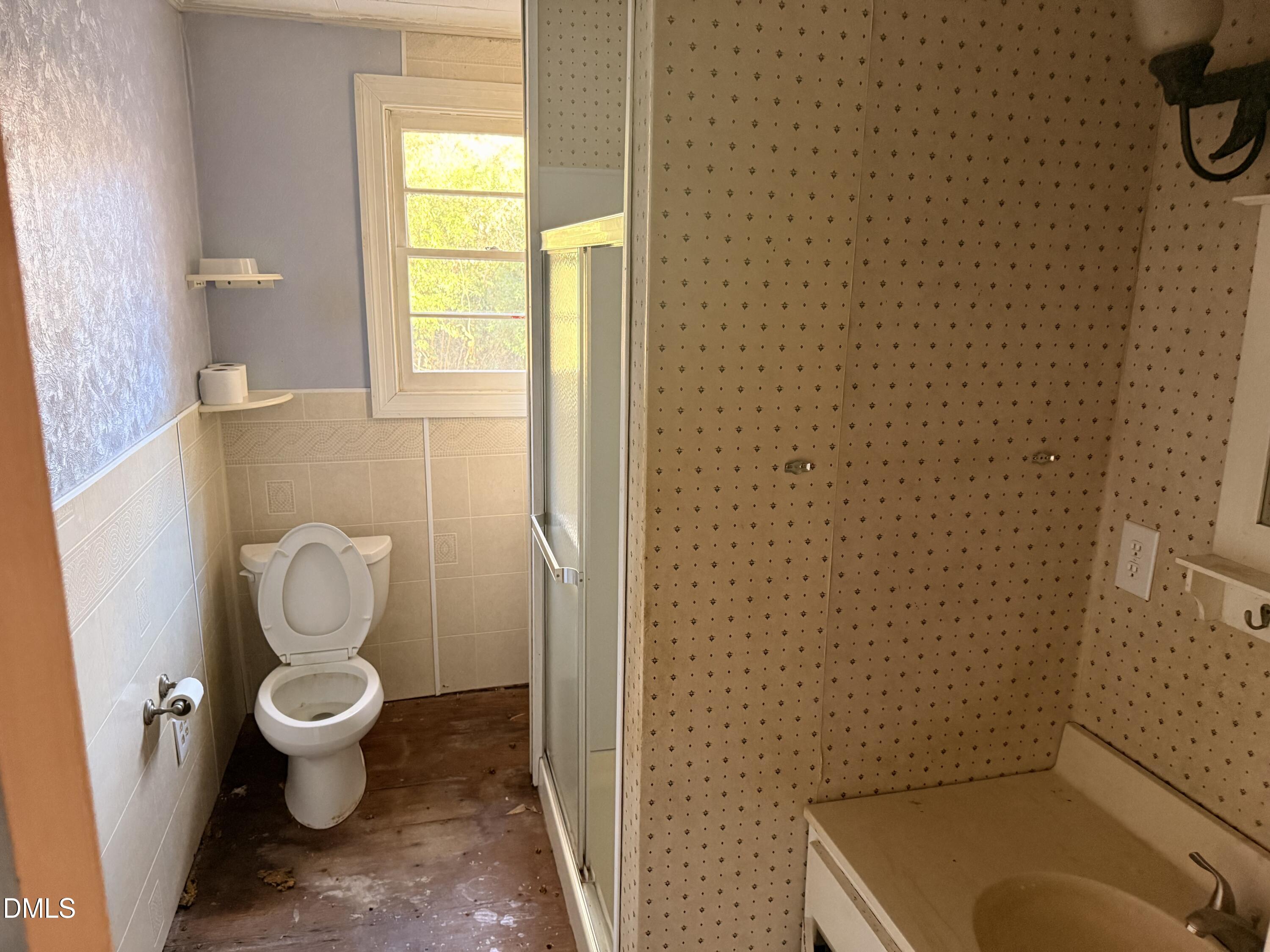 8066 Springfield School Road Kenly, NC 27542 - Photo 9 of 11 a bathroom with a toilet and a shower