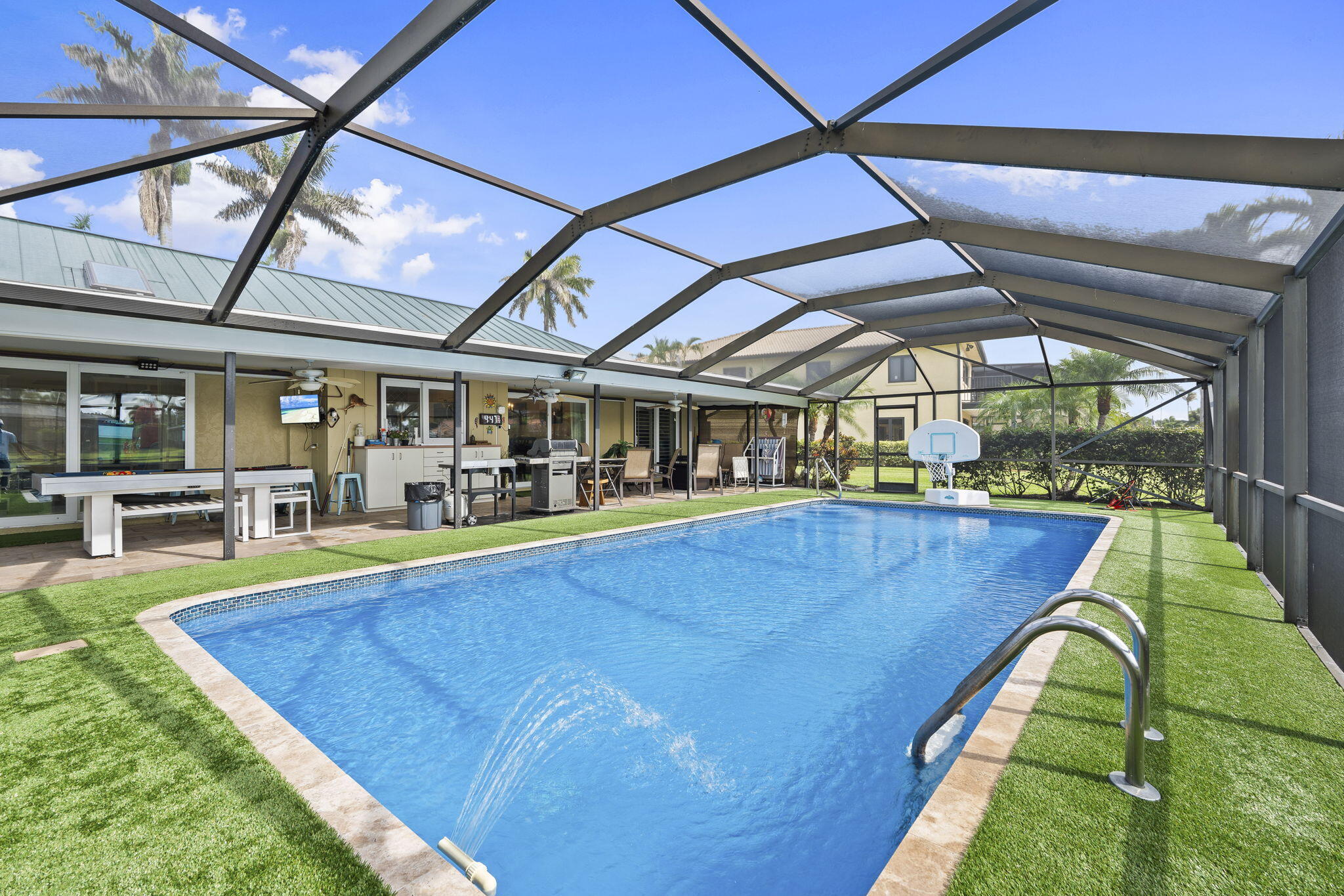 3374 Southeast Fairway East Stuart, FL 34997 - Photo 30 of 65 a view of a swimming pool with a patio