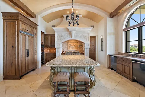 a living room with furniture a flat screen tv and a floor to ceiling window