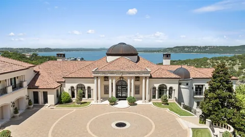 a front view of a house with a garden and patio