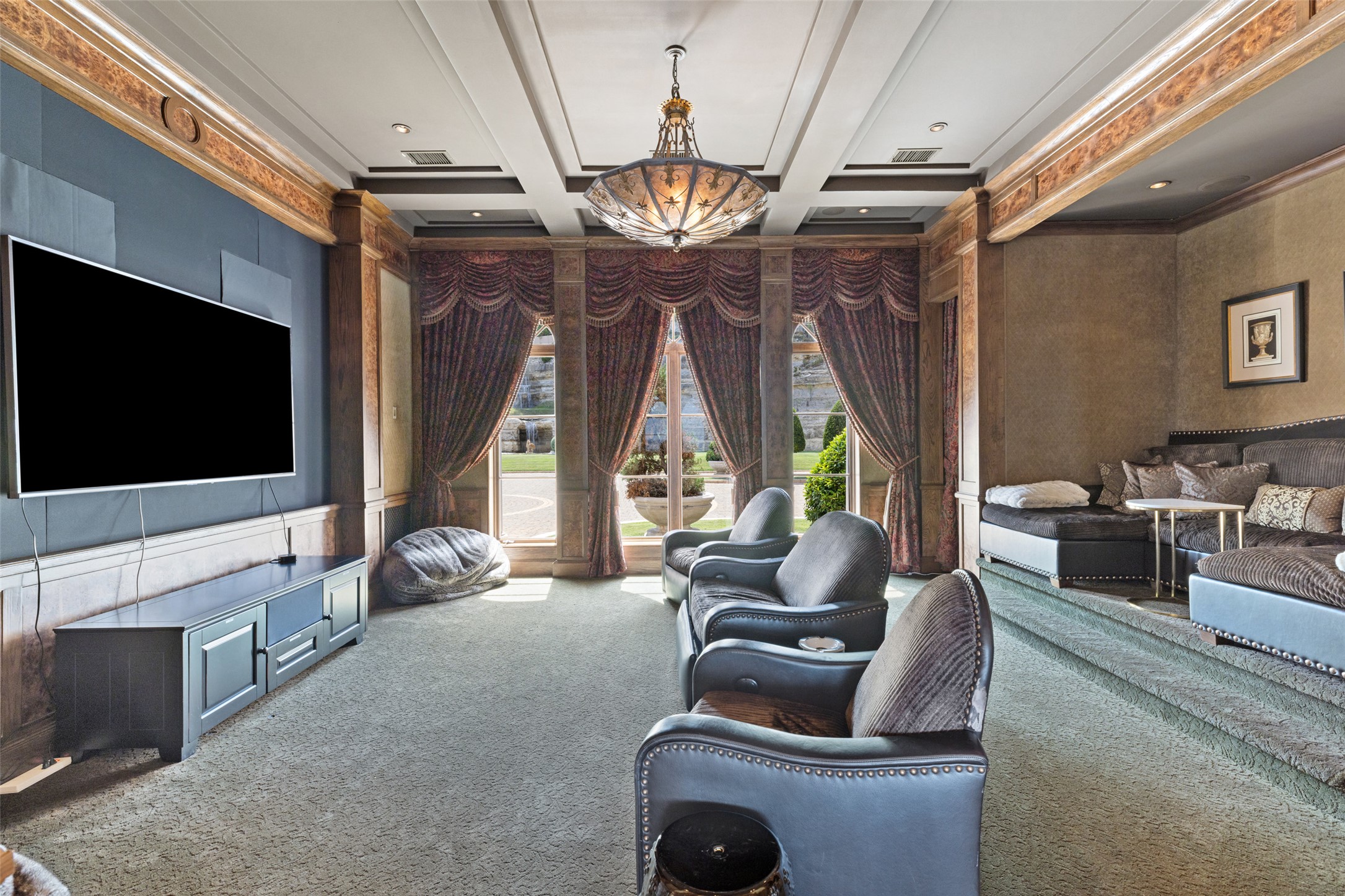 12400 Cedar Street Austin, TX 78732 - Photo 21 of 39 a living room with furniture a flat screen tv and a large window