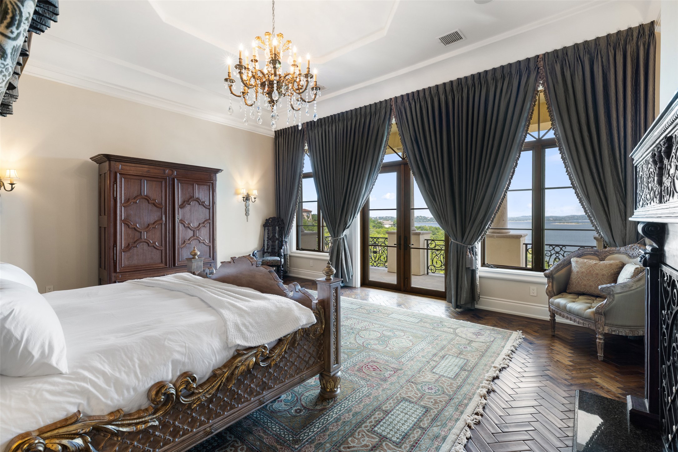 12400 Cedar Street Austin, TX 78732 - Photo 22 of 39 a spacious bedroom with a bed and a large window