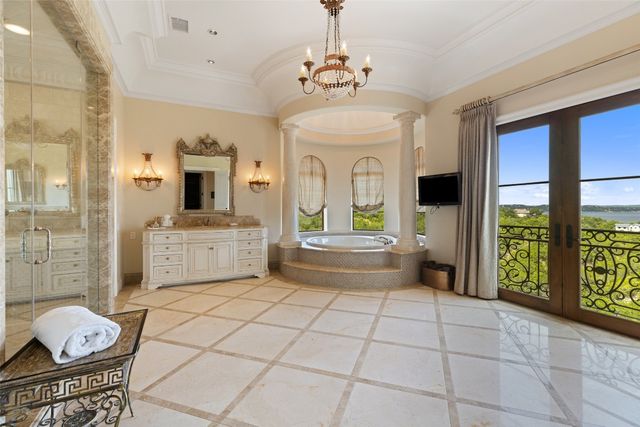a bathroom with a glass shower door