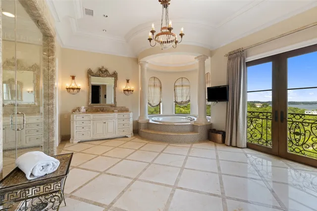 a bathroom with a glass shower door